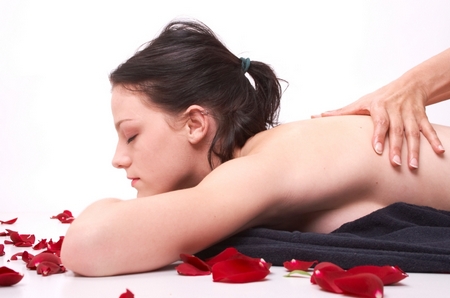 realxation in massage with petals arround